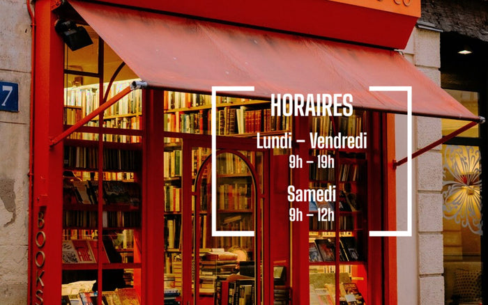 Sticker horaires blanc posé sur la vitrine rouge d'une librairie