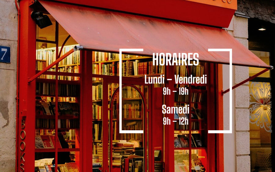 Sticker horaires blanc posé sur la vitrine rouge d'une librairie